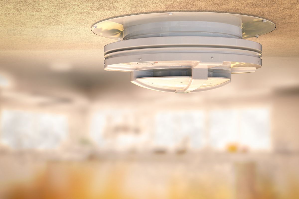 Smoke alarm mounted on a kitchen ceiling